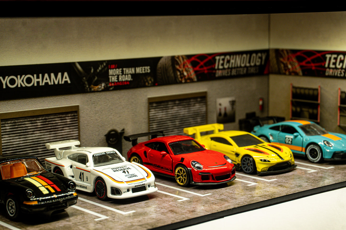 Yokohama Tire Workshop Garage Diorama – 1:64 Scale Acrylic Diorama (30x14x10 cm)
