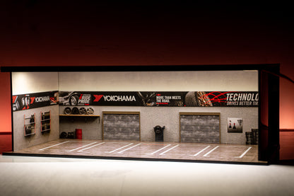 Yokohama Tire Workshop Garage Diorama – 1:64 Scale Acrylic Diorama (30x14x10 cm)