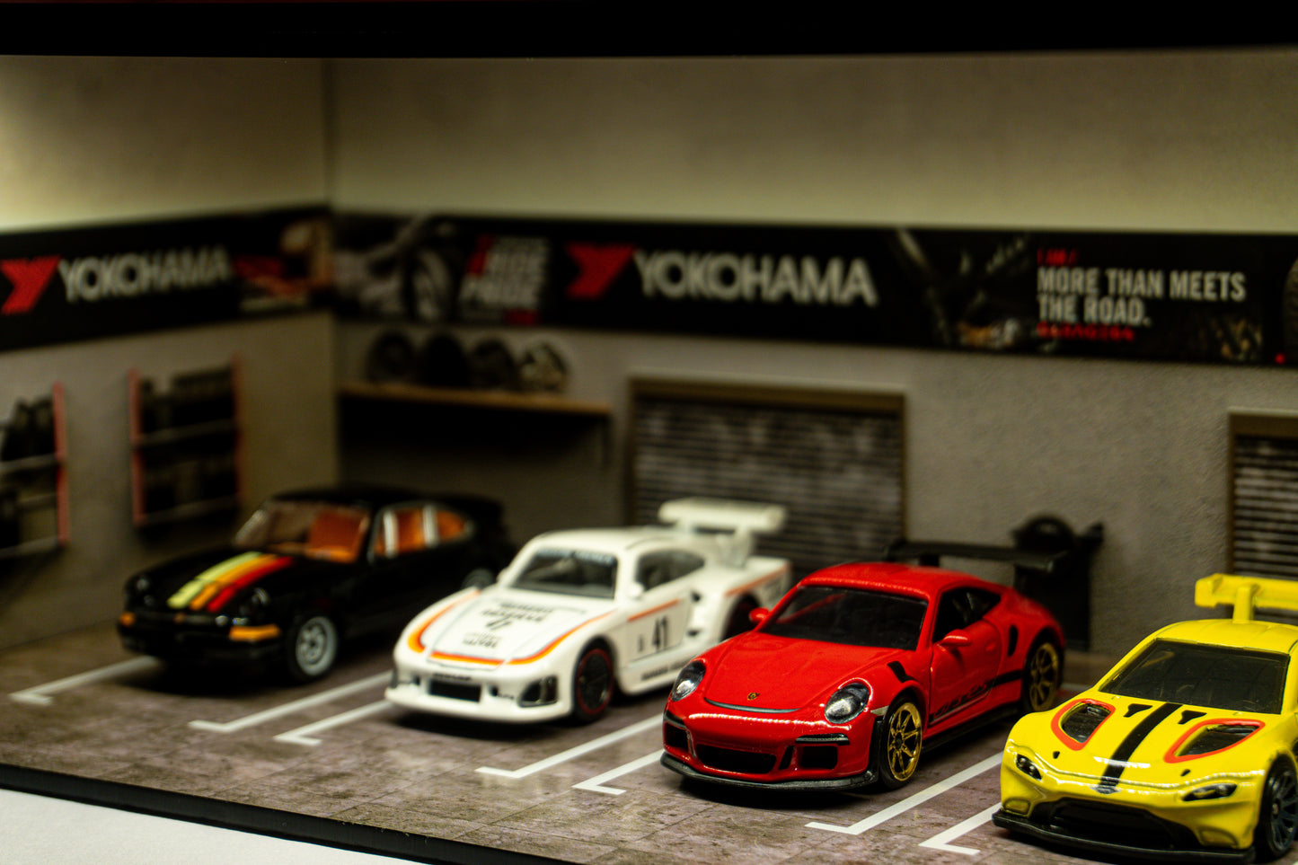 Yokohama Tire Workshop Garage Diorama – 1:64 Scale Acrylic Diorama (30x14x10 cm)